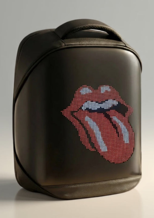 Black backpack with Rolling Stones logo on a desk